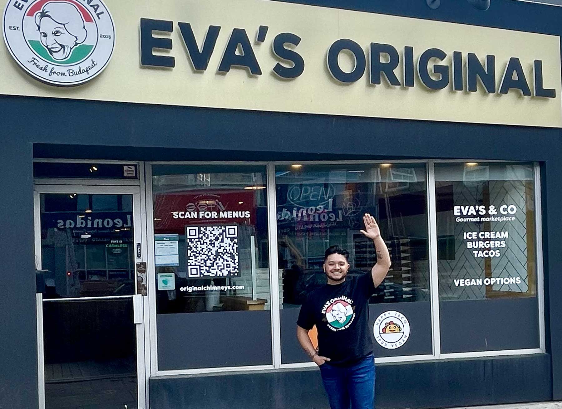 Jose in front of his Eva's Original Port Credit location that he franchised in 2023.